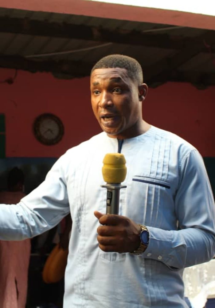 Member of the District Assembly at Ablekuma North addresing widows at 2018 Christmas fetes